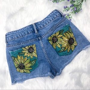 Hand painted sunflower jean cutoff shorts